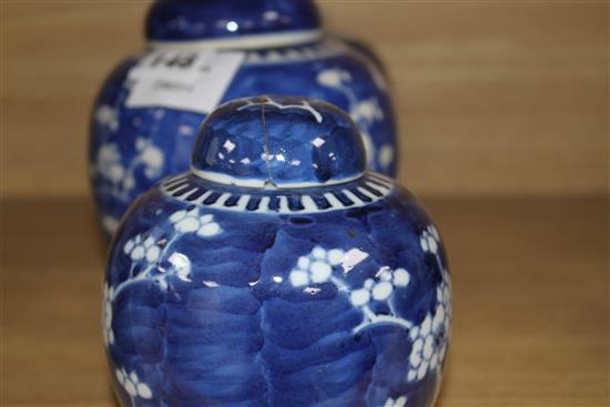 Three Chinese blue and white prunus jars and two covers, early 20th century, height 12cm - 13.5cm